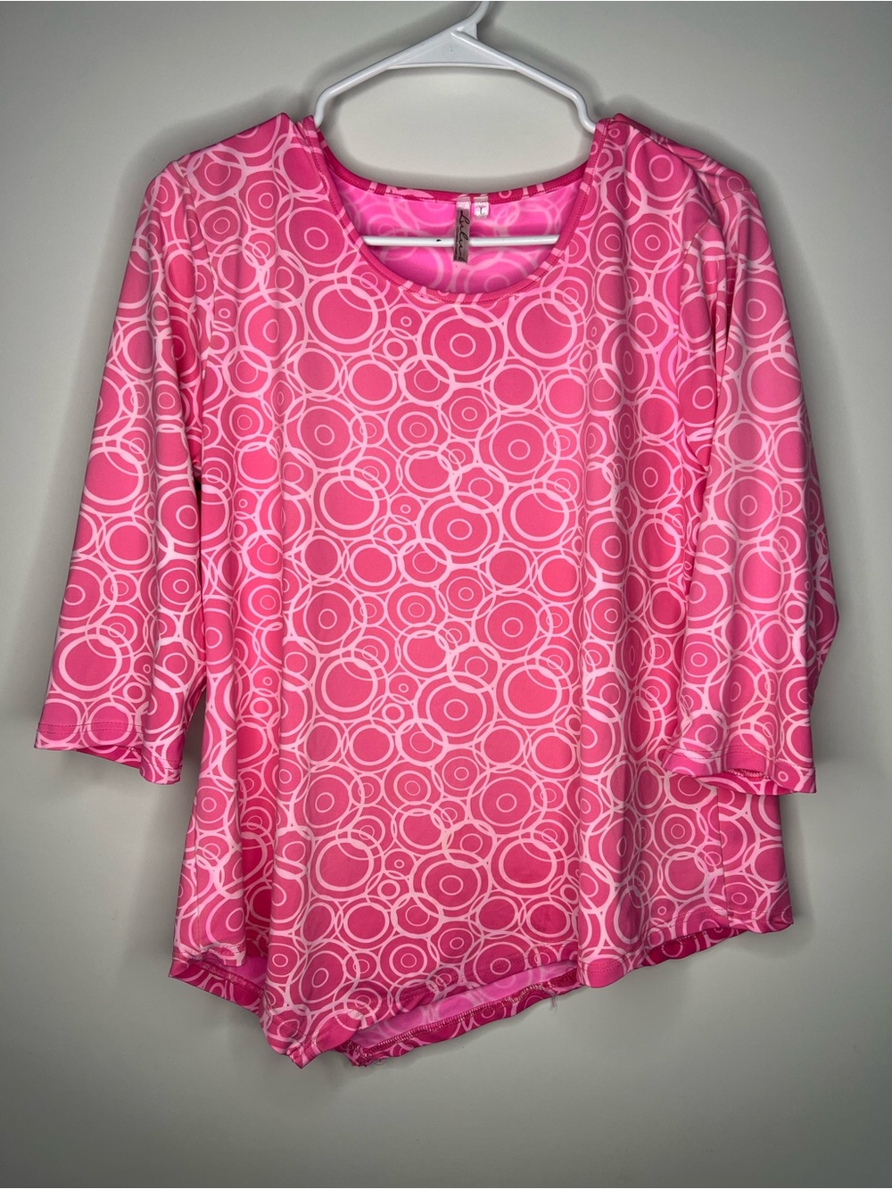 pink circle print tunic top with asymmetrical hem size large
